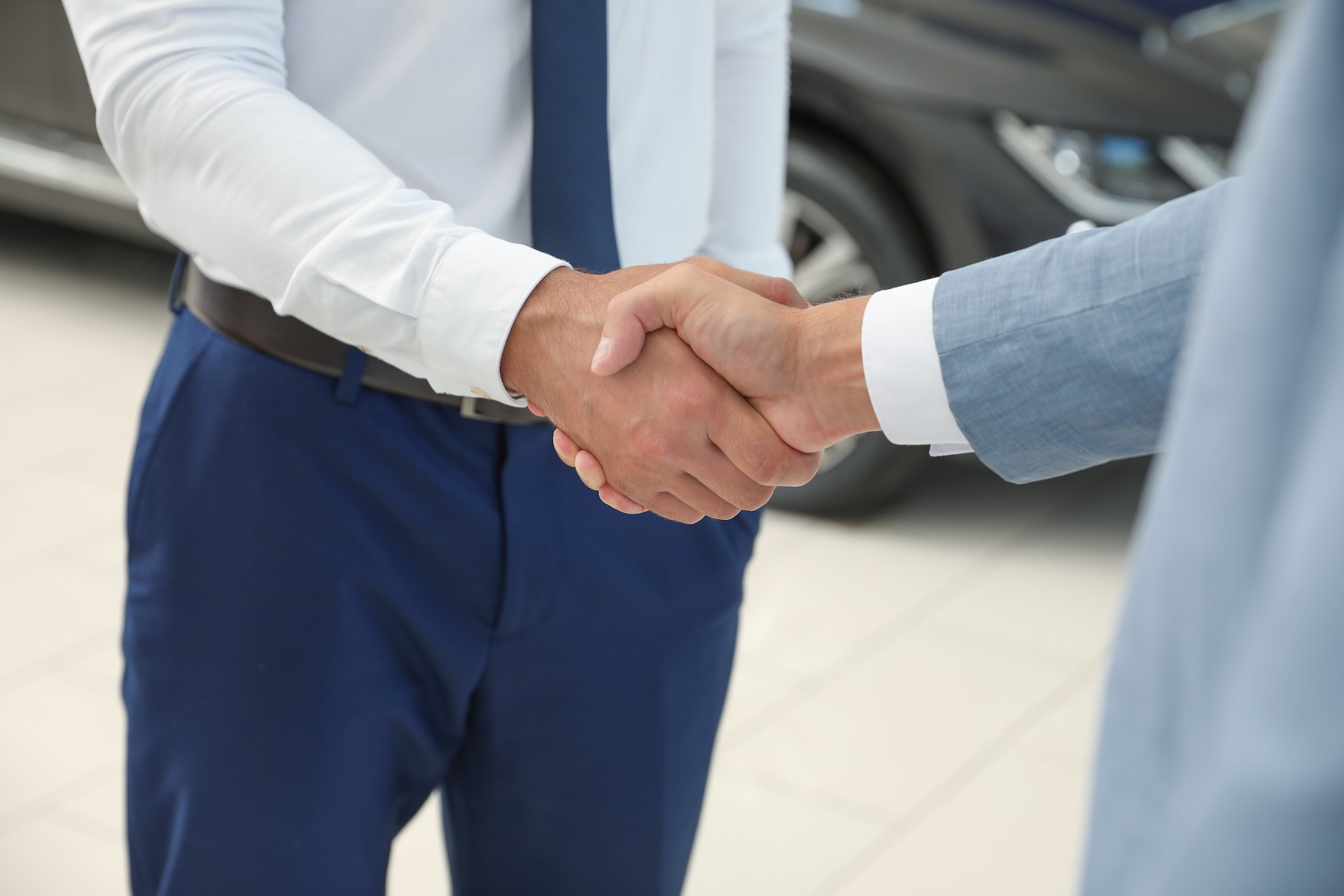 Handshake between dealership representative and customer